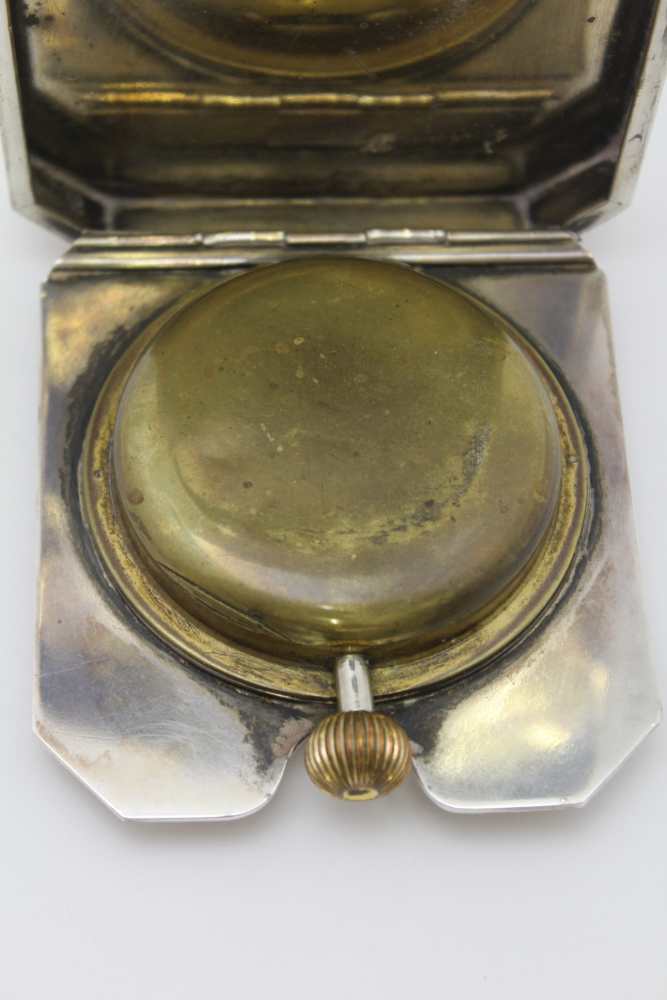 GOLDSMITHS & SIVERSMITH CO. LTD, A SILVER CASED TRAVEL CLOCK, hinged form with bounds reed edge, - Image 6 of 6