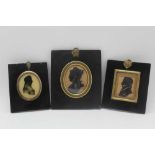 THREE 19TH CENTURY SILHOUETTES, profile portraits, one of an officer with epaulettes, two oval