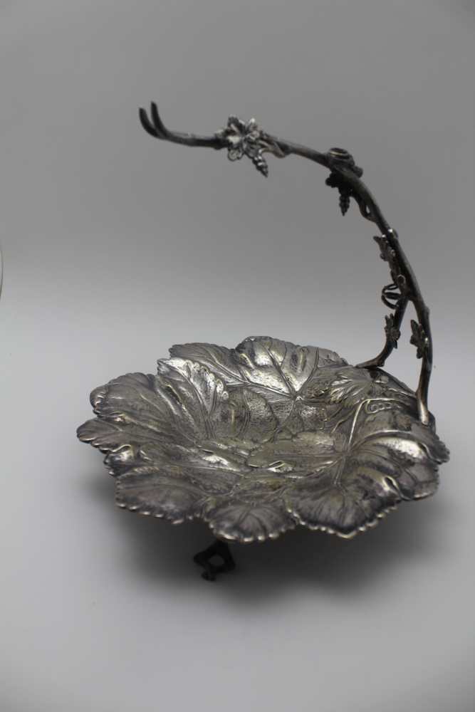 A VICTORIAN SILVER PLATED GRAPE DISH, moulded leaf form with vine arm to support the bunch, raised - Image 3 of 4