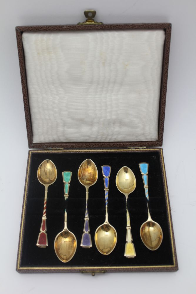 TURNER & SIMPSON, A CASED SET OF SIX SILVER GILT & ENAMEL COFFEE SPOONS, Harlequin of guilloche