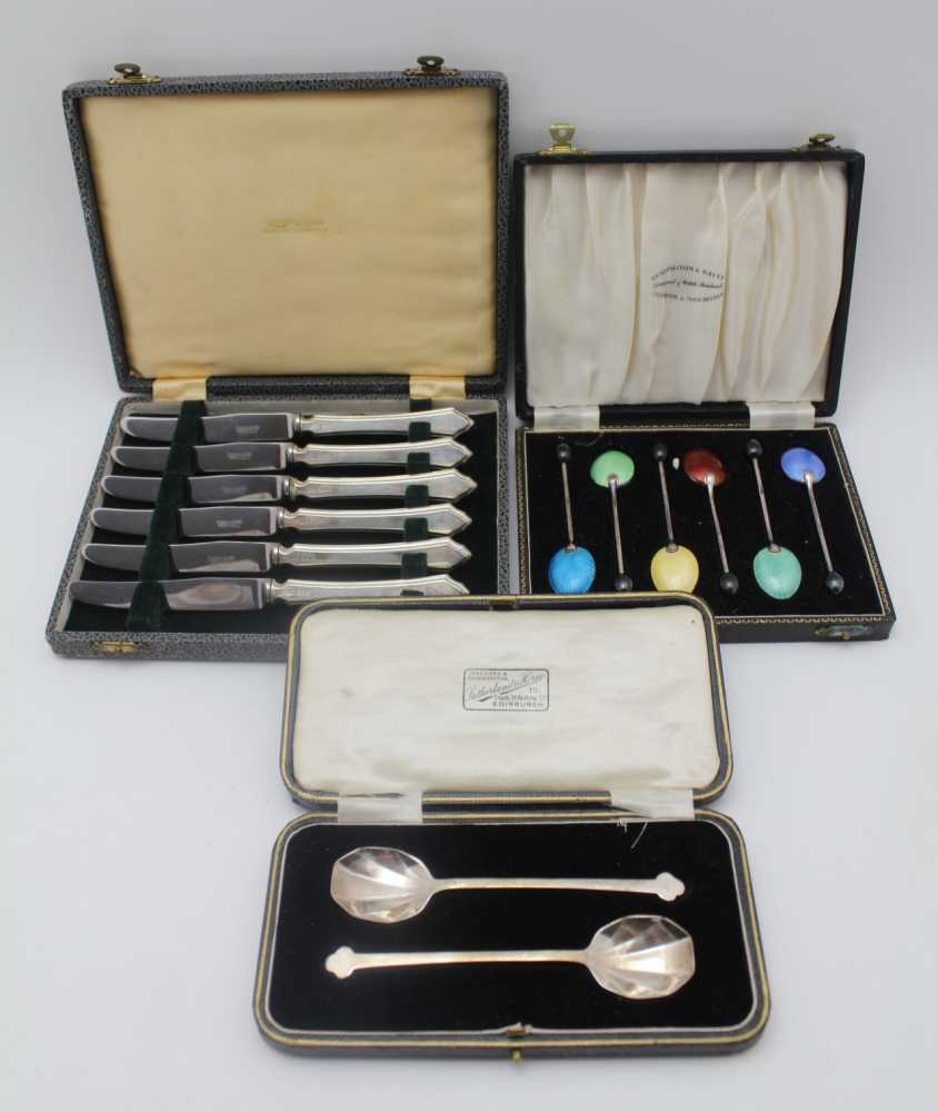 COOPER BROTHERS & SONS A cased pair of silver jam spoons, with trefid handle tips, Sheffield 1926 in