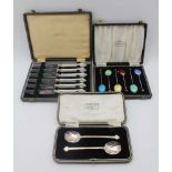 COOPER BROTHERS & SONS A cased pair of silver jam spoons, with trefid handle tips, Sheffield 1926 in