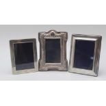 A VICTORIAN DESIGN DECORATIVELY SILVER MOUNTED PHOTOGRAPH FRAME, fluted decoration, fabric easel