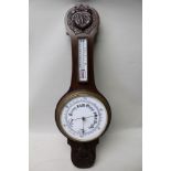 A LATE 19TH / EARLY 20TH CENTURY OAK BACKED BANJO BAROMETER THERMOMETER with carved decoration, 75cm