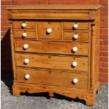 A 19TH CENTURY POSSIBLE SCOTTISH PINE CHEST having full width cushion fronted top drawer, over two