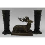 A CAST BRONZE RECLINING STAG, possibly 19th century Jaipur, raised on plinth base, 10cm high,