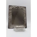 WILLIAM NEALE, AN EDWARDIAN SILVER MOUNTED DRESSING TABLE MIRROR, embossed Art Nouveau floral