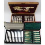 AN OAK CASE OF SILVER FISH KNIVES & FORKS FOR TWELVE SETTINGS, fitted to the lid interior with