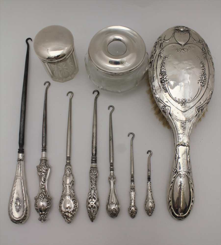 RICHARD OWEN WILLIAMS, A SILVER TOP GLASS HAIR TIDY, Chester 1921, together with; a silver lidded