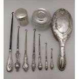 RICHARD OWEN WILLIAMS, A SILVER TOP GLASS HAIR TIDY, Chester 1921, together with; a silver lidded