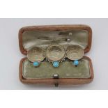 A CASE OF THREE 14CT GOLD DRESS STUDS, set turquoise, and a triple coin brooch (2)
