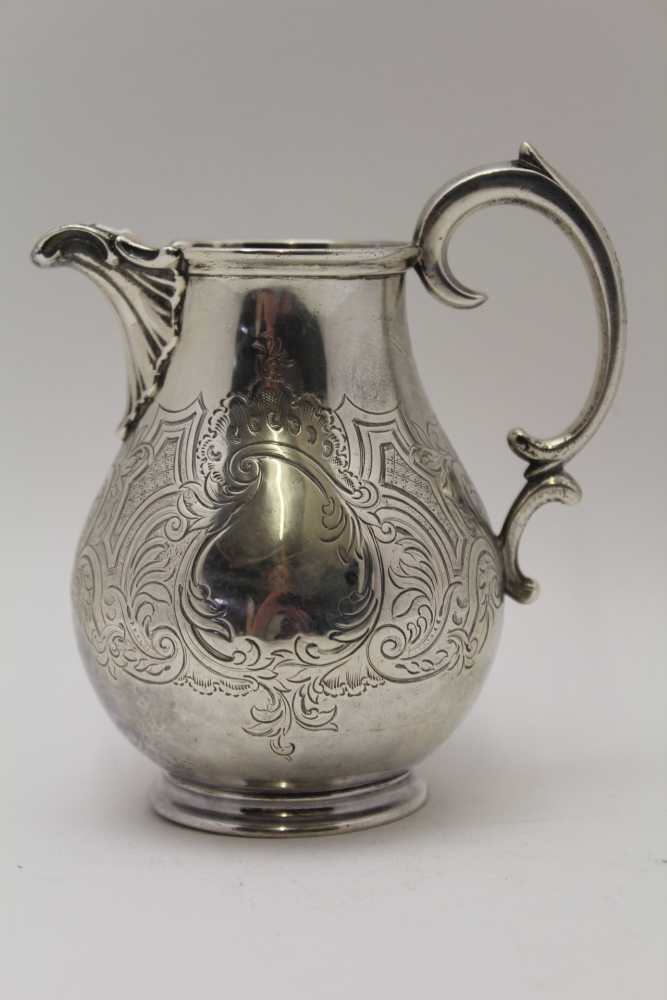 EDWARD, EDWARD JUNIOR, JOHN & WILLIAM BARNARD A silver milk jug, sea scroll handle, fluted spout