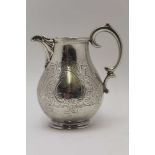 EDWARD, EDWARD JUNIOR, JOHN & WILLIAM BARNARD A silver milk jug, sea scroll handle, fluted spout