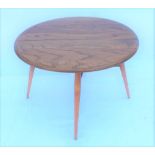 AN ERCOL DEMI-LUNE COFFEE TABLE with single flap, transferring to a circular top, supported on three