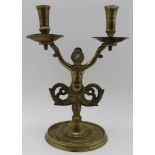 A 19TH CENTURY DUTCH BRASS CANDLE HOLDER, twin sconces held aloft by a mermaid on circular