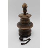 AN 18TH CENTURY LIGNUM VITAE COFFEE GRINDER, turned in sections, removable cover, the central