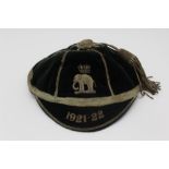 AN EARLY 20TH CENTURY SPORTING ACHIEVEMENT CAP, green velvet with wire work embroidery and tassel,