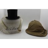 A 'WOODROWS' SILK TOP HAT, printed internal label, in remains of a card hat box, together with a