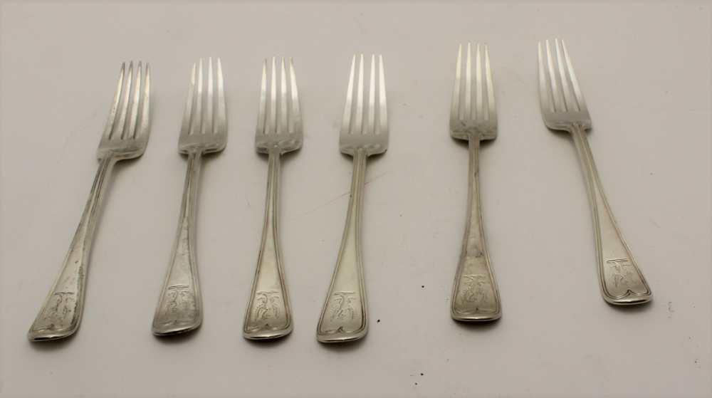 CHARLES BOYTON A set of six silver table forks, engraved with a spread eagle crest, London 1884,