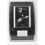 BOB DYLAN AUTOGRAPH (quite faded), mounted together with a photograph, silvered frame, black