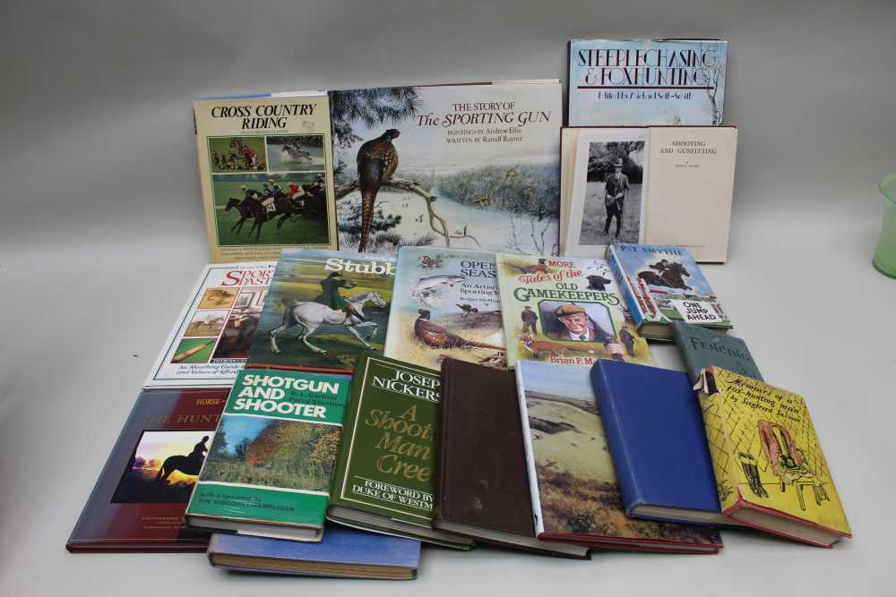 A BOX CONTAINING A SELECTION OF HARDBACKED BOOKS on a variety of sporting subjects