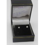 A PAIR OF SOLITAIRE DIAMOND STUD EARRINGS, in vendor's box, with receipt for £318.00, dated 28/04/