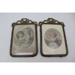 A PAIR OF VICTORIAN PRESSED BRASS FRAMES WITH RIBBON MOUNTS, glazed, each contains hand coloured