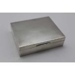 ASPREY & CO LTD A plain silver cigarette box with hinged cover, cedar lined, 10cm wide, London 1955