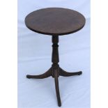 A 19TH CENTURY OAK CIRCULAR TOPPED TABLE on turned column, and three outswept legs, 68cm high,