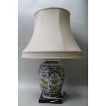 A DELFT GINGER JAR, converted to a table lamp on ebonised base, 34cm high (with shade)