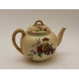 A ROYAL WORCESTER BLUSH IVORY GROUND PORCELAIN TEAPOT, hand painted floral decoration, gilded