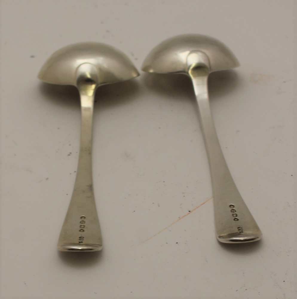 GEORGE ALDWINCKLE A pair of late 19th century silver sauce ladles, engraved with a spread eagle - Image 2 of 3