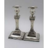 HARRISON BROTHERS & HOWSON A pair of late Victorian silver candlesticks, of classical column design,
