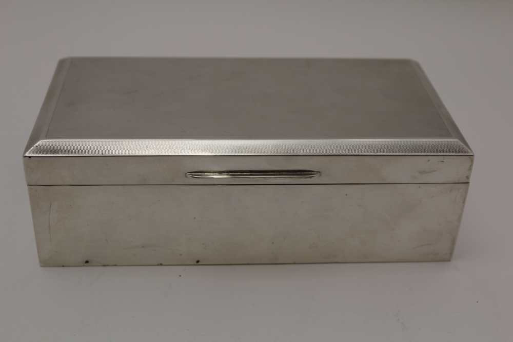 D.BROS, A SILVER CIGARETTE BOX, engine turned hinged lid, cedar wood lined, 16.5cm x 8.5cm x 5cm,