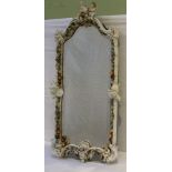 A GERMAN PORCELAIN FRAMED PIER MIRROR, floral encrusted and cherubs mounted, fitted candle sconces