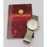 A LONGINES GENTLEMAN'S 9CT GOLD WRISTWATCH, the dial with baton markers and secondary dial, on a