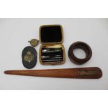 AN EARLY 19TH CENTURY MINIATURE TOOL KIT, a turned bone handle with interchangeable steel tips, in