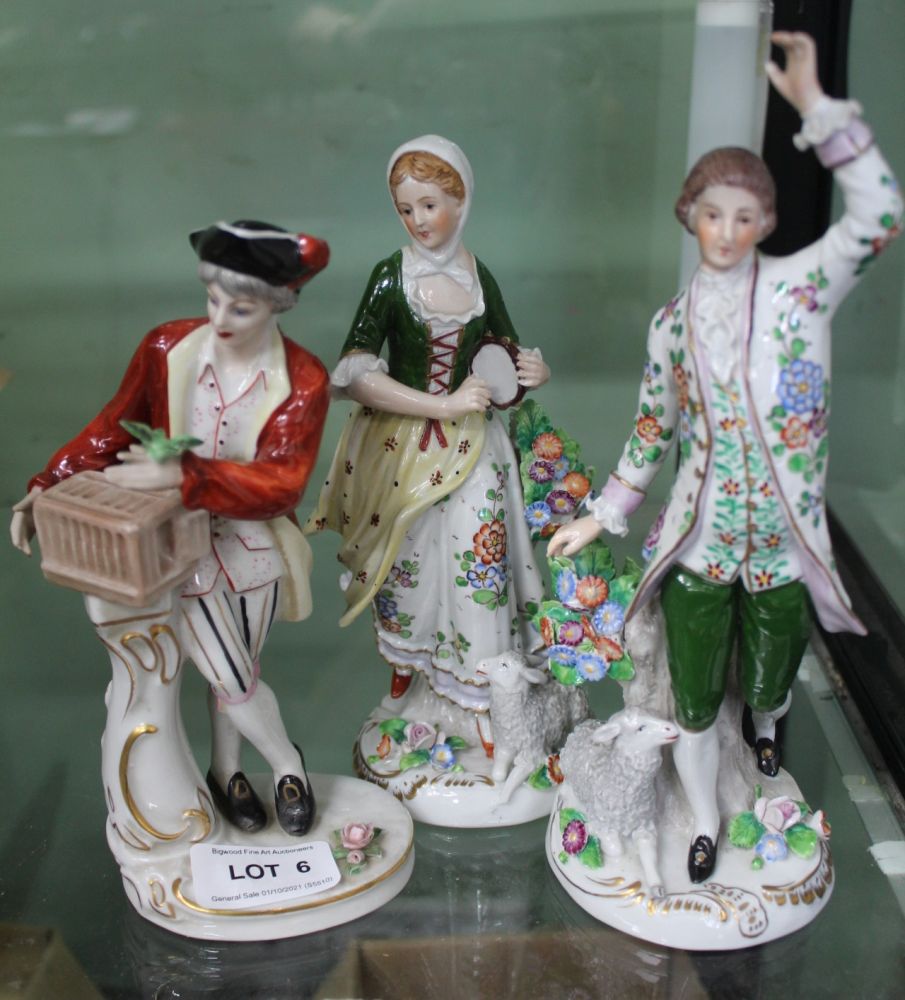 A PAIR OF CONTINENTAL PORCELAIN MALE & FEMALE FIGURES in the style of Sitzendorf together with one