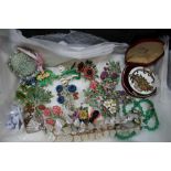 A PLASTIC CRATE CONTAINING A SELECTION OF FLORAL COSTUME JEWELLERY mother-of-pearl necklaces,