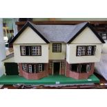 A c.1940s LARGE SIZED DOLL'S HOUSE, Triang no. 92, having double opening double gable frontage (va