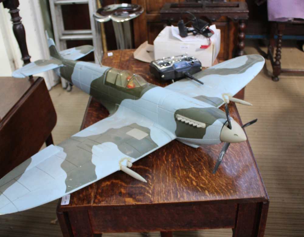 A REMOTE CONTROLLED MODEL SPITFIRE complete with accessories