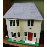 A 1950s SMALL SIZED TRIANG 50 DOLL'S HOUSE with single opening front, 50cm x 45cm