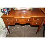 AN EDWARDIAN MAHOGANY LADIES WRITING TABLE with plain top, having single central drawer, flanked
