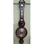 A 19TH CENTURY MAHOGANY WHEEL BAROMETER, the case with Swan neck pediment, silvered original main