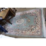 A ROOM SIZE BLUE GROUND CHINESE WASHED WOOL FLOOR CARPET, with floral decoration