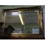 A LARGE FANCY GILT FRAMED RECTANGULAR BEVELLED PLATE WALL MIRROR