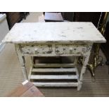 A DISTRESSED EFFECT RECTANGULAR TOPPED SIDE TABLE with two drawers & slatted undertier