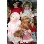A BOX CONTAINING A LARGE SELECTION OF DOLLS VARIOUS