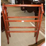 A WOODEN FIVE BAR TOWEL RAIL