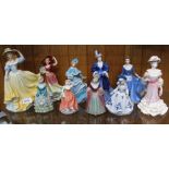 A SHELF FULL OF FEMALE FIGURINES VARIOUS to include Wedgwood & Coalport examples